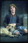Actress Andrea McArdle as Annie w. Sandy in a scene from the Broadway production of the musical "Annie."