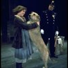 Actress Andrea McArdle as Annie w. Sandy and a policeman in a scene from the Broadway production of the musical "Annie."