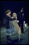 Actress Andrea McArdle as Annie w. Sandy and a policeman in a scene from the Broadway production of the musical "Annie."