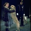 Actress Andrea McArdle as Annie w. Sandy and a policeman in a scene from the Broadway production of the musical "Annie."