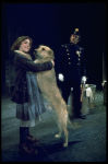 Actress Andrea McArdle as Annie w. Sandy and a policeman in a scene from the Broadway production of the musical "Annie."