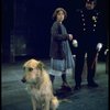Actress Andrea McArdle as Annie w. Sandy and a policeman in a scene from the Broadway production of the musical "Annie."