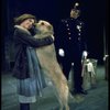 Actress Andrea McArdle as Annie w. Sandy and a policeman in a scene from the Broadway production of the musical "Annie."