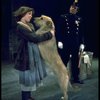 Actress Andrea McArdle as Annie w. Sandy and a policeman in a scene from the Broadway production of the musical "Annie."