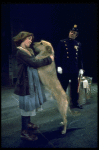 Actress Andrea McArdle as Annie w. Sandy and a policeman in a scene from the Broadway production of the musical "Annie."