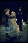 Actress Andrea McArdle as Annie w. Sandy and a policeman in a scene from the Broadway production of the musical "Annie."