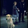 Actress Andrea McArdle as Annie w. Sandy and a policeman in a scene from the Broadway production of the musical "Annie."