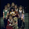 Actress Andrea McArdle as Annie w. Sandy, Danielle Brisebois and orphans in a scene from the Broadway production of the musical "Annie."