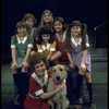 Actress Andrea McArdle as Annie w. Sandy, Danielle Brisebois and orphans in a scene from the Broadway production of the musical "Annie."