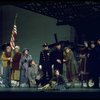 Actress Andrea McArdle as Annie w. Sandy and Hooverville-ites in a scene from the Broadway production of the musical "Annie."