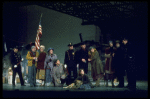 Actress Andrea McArdle as Annie w. Sandy and Hooverville-ites in a scene from the Broadway production of the musical "Annie."