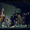 Actress Andrea McArdle as Annie w. Sandy and Hooverville-ites in a scene from the Broadway production of the musical "Annie."