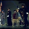 Actress Andrea McArdle as Annie w. Sandy and Hooverville-ites in a scene from the Broadway production of the musical "Annie."