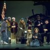 Actress Andrea McArdle as Annie w. Sandy and Hooverville-ites in a scene from the Broadway production of the musical "Annie."