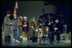 Actress Andrea McArdle as Annie w. Sandy and Hooverville-ites in a scene from the Broadway production of the musical "Annie."