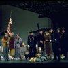 Actress Andrea McArdle as Annie w. Sandy and Hooverville-ites in a scene from the Broadway production of the musical "Annie."