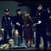 Actress Andrea McArdle as Annie w. Sandy and Hooverville-ites in a scene from the Broadway production of the musical "Annie."