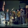 Actress Andrea McArdle as Annie w. Sandy and Hooverville-ites in a scene from the Broadway production of the musical "Annie."