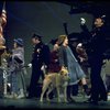 Actress Andrea McArdle as Annie w. Sandy and Hooverville-ites in a scene from the Broadway production of the musical "Annie."