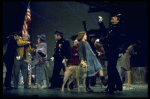 Actress Andrea McArdle as Annie w. Sandy and Hooverville-ites in a scene from the Broadway production of the musical "Annie."