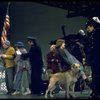 Actress Andrea McArdle as Annie w. Sandy and Hooverville-ites in a scene from the Broadway production of the musical "Annie."
