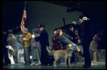 Actress Andrea McArdle as Annie w. Sandy and Hooverville-ites in a scene from the Broadway production of the musical "Annie."