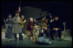 Actress Andrea McArdle as Annie w. Sandy and Hooverville-ites in a scene from the Broadway production of the musical "Annie."