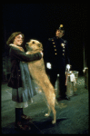 Actress Andrea McArdle as Annie w. Sandy and a policeman in a scene from the Broadway production of the musical "Annie."