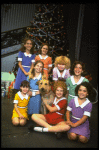 Actress Shelley Bruce as Annie w. Sandy and orphans in a scene from the Broadway production of the musical "Annie."