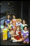 Actress Shelley Bruce as Annie w. Sandy and orphans in a scene from the Broadway production of the musical "Annie."