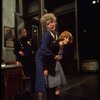 R-L) Actresses Dorothy Loudon as Miss Hannigan and Shelley Bruce as Annie w. a policeman in a scene from the Broadway production of the musical "Annie."