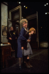 R-L) Actresses Dorothy Loudon as Miss Hannigan and Shelley Bruce as Annie w. a policeman in a scene from the Broadway production of the musical "Annie."