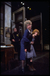 R-L) Actresses Dorothy Loudon as Miss Hannigan and Shelley Bruce as Annie w. a policeman in a scene from the Broadway production of the musical "Annie."