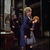 R-L) Actresses Dorothy Loudon as Miss Hannigan and Shelley Bruce as Annie w. a policeman in a scene from the Broadway production of the musical "Annie."