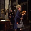 R-L) Actresses Dorothy Loudon as Miss Hannigan and Shelley Bruce as Annie w. a policeman in a scene from the Broadway production of the musical "Annie."