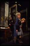 R-L) Actresses Dorothy Loudon as Miss Hannigan and Shelley Bruce as Annie w. a policeman in a scene from the Broadway production of the musical "Annie."