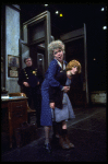 R-L) Actresses Dorothy Loudon as Miss Hannigan and Shelley Bruce as Annie w. a policeman in a scene from the Broadway production of the musical "Annie."