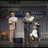 Actors Reid Shelton as Daddy Warbucks (2R) and Shelley Bruce as Annie (2L) in a scene from the Broadway production of the musical "Annie."