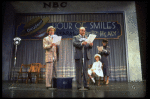 Actors Reid Shelton as Daddy Warbucks (2R) and Shelley Bruce as Annie (2L) in a scene from the Broadway production of the musical "Annie."