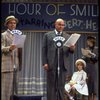 Actors Reid Shelton as Daddy Warbucks (2R) and Shelley Bruce as Annie (2L) in a scene from the Broadway production of the musical "Annie."