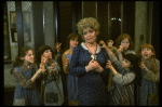 Actress Dorothy Loudon as Miss Hannigan (C) surrounded by orphans incl. Danielle Brisebois (2L) in a scene from the Broadway production of the musical "Annie."