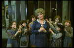 Actress Dorothy Loudon as Miss Hannigan (C) surrounded by orphans incl. Danielle Brisebois (2L) in a scene from the Broadway production of the musical "Annie."