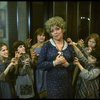 Actress Dorothy Loudon as Miss Hannigan (C) surrounded by orphans incl. Danielle Brisebois (2L) in a scene from the Broadway production of the musical "Annie."