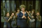 Actress Dorothy Loudon as Miss Hannigan (C) surrounded by orphans incl. Danielle Brisebois (2L) in a scene from the Broadway production of the musical "Annie."