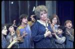 Actress Dorothy Loudon as Miss Hannigan (C) surrounded by orphans incl. Danielle Brisebois (2L) in a scene from the Broadway production of the musical "Annie."