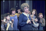 Actress Dorothy Loudon as Miss Hannigan (C) surrounded by orphans incl. Danielle Brisebois (2L) in a scene from the Broadway production of the musical "Annie."