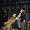 Actress Shelley Bruce as Annie w. Sandy and a policeman in a scene from the Broadway production of the musical "Annie."