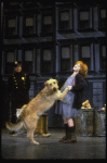 Actress Shelley Bruce as Annie w. Sandy and a policeman in a scene from the Broadway production of the musical "Annie."