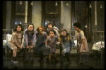 Sarah Jessica Parker as Annie w. orphans in a scene from the Broadway production of the musical "Annie."