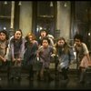 Sarah Jessica Parker as Annie w. orphans in a scene from the Broadway production of the musical "Annie."